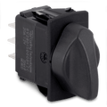 Close-up of a black rotary switch with a large ergonomic knob and three metal prongs, designed for control panels, labeled Sierra Contura Rotary Switch RS20010.