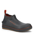 Simms Challenger Slip-On Shoe in black with orange accents, featuring a slip-on design, rugged sole, and durable waterproof material ideal for fishing and outdoor activities.