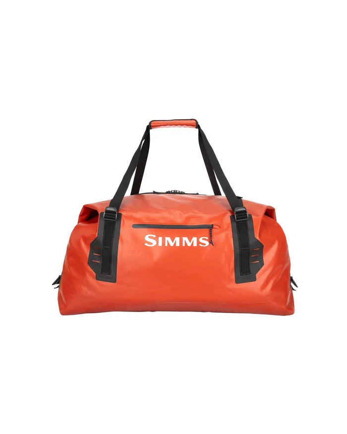 Simms Dry Creek Duffel in bright orange with black straps and a zippered front pocket, designed for durable, waterproof storage for fishing tackle and gear.