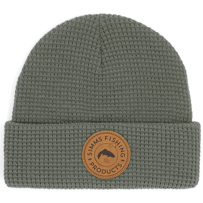 Simms Everyday Waffle Knit Beanie in olive green with a textured knit pattern and a round leather patch featuring Simms Fishing Products logo on the cuff.
