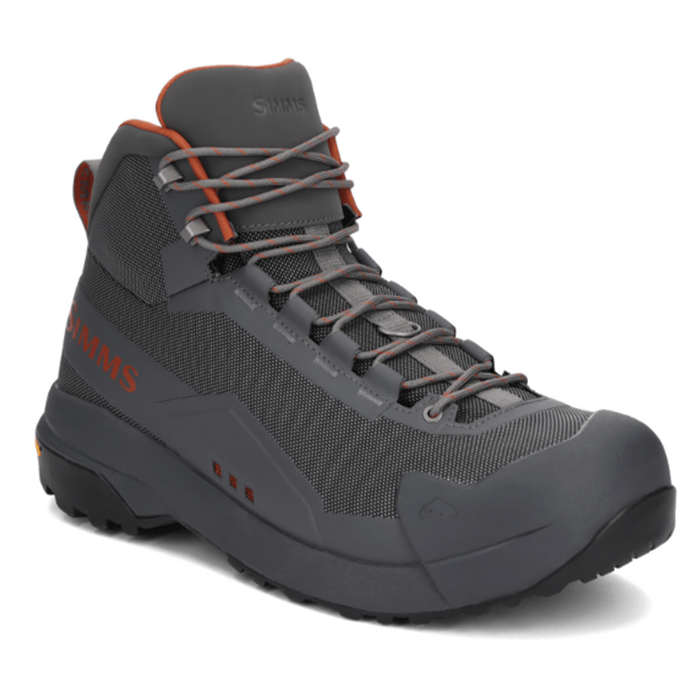 Simms Flyweight Wading Boot - Vibram Sole in dark gray with orange accents, featuring mesh panels, durable sole, and secure lacing designed for comfortable fishing wading.