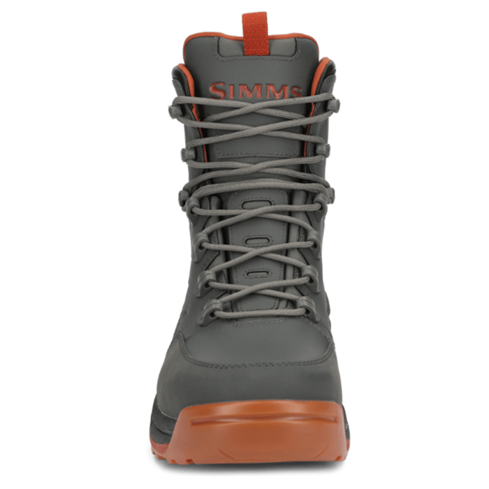 Simms FreeSalt Boots in gray with orange accents, featuring a high ankle design, durable laces, and a sturdy sole for fishing and outdoor activities.