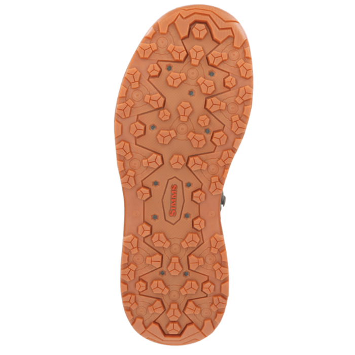 Sole view of Simms FreeSalt Boots showing durable orange rubber outsole with multi-directional lugs for enhanced grip and stability during fishing activities.