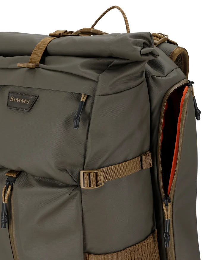 Simms Headwaters Backpack in olive green with multiple zippered compartments, adjustable straps, and durable construction designed for fishing tackle and outdoor use.