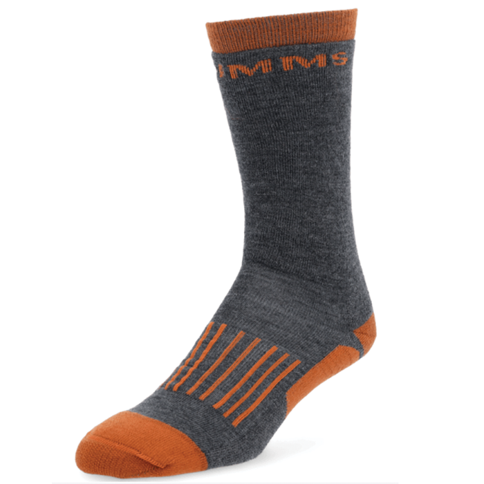 Simms Merino Midweight Hiker Socks - Men's in dark gray with burnt orange accents on the cuff, heel, toe, and arch support stripes, designed for outdoor comfort and durability.