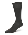 Black Simms Mid-Calf Sock Liner displayed on a mannequin foot, featuring a smooth, lightweight fabric designed for comfortable layering during fishing activities.