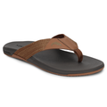 Simms Panga Flip Flops in brown and black with a comfortable cushioned footbed, durable woven straps, and a small fish emblem on the upper strap, designed for casual outdoor wear.