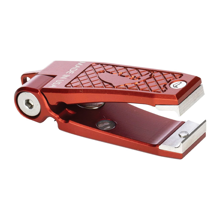 Simms Pro Nipper in red anodized metal with textured grip and sharp cutting edges, designed for precise fishing line cutting and tackle maintenance.