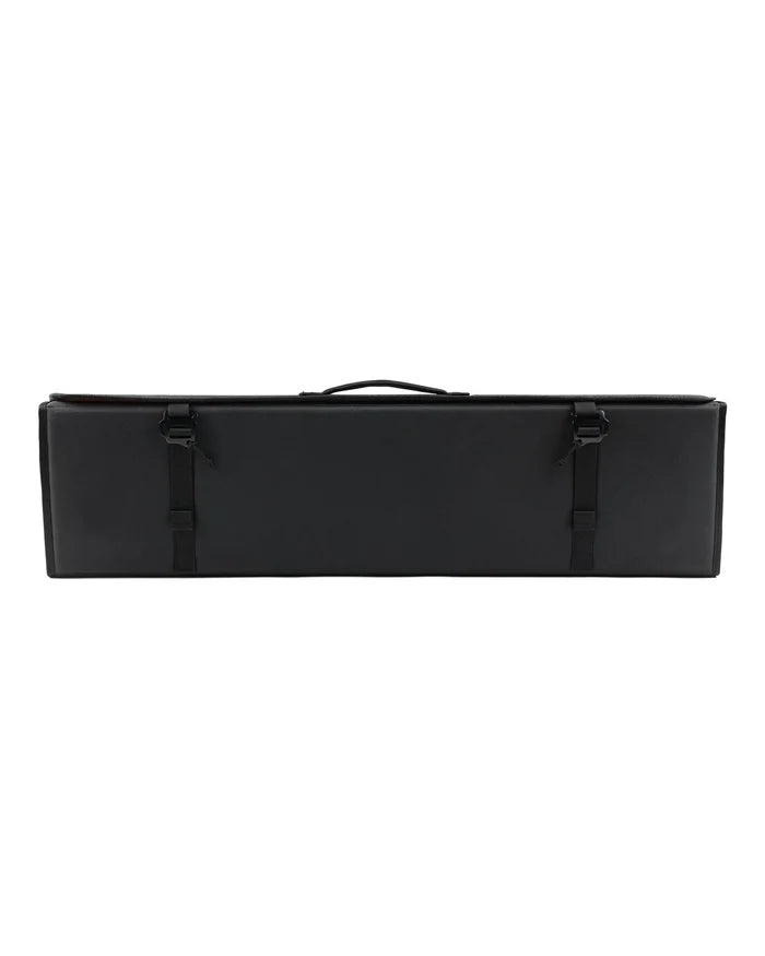 Simms Riverkit Rod Roll in black with a rectangular shape, featuring a handle on top and two adjustable buckle straps for secure closure, designed for organizing fishing rods and tackle.