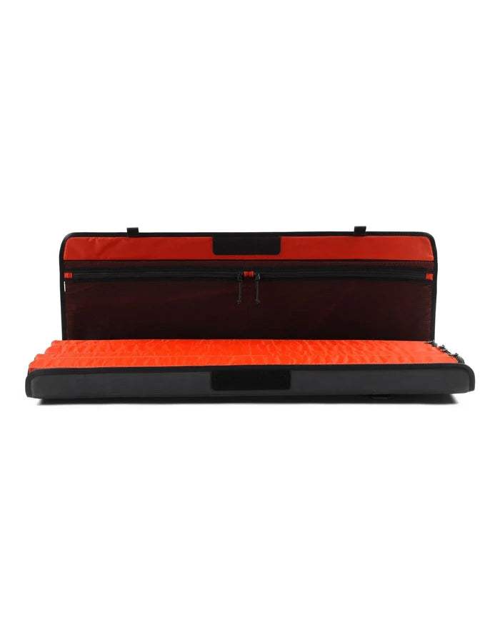 Simms Riverkit Rod Roll open flat displaying bright orange padded interior designed to safely store and protect fishing rods and tackle during transport.