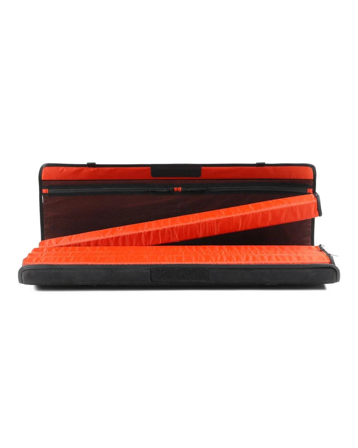 Simms Riverkit Rod Roll open to show bright orange padded interior compartments designed to securely hold and protect fishing rods and reels during transport.