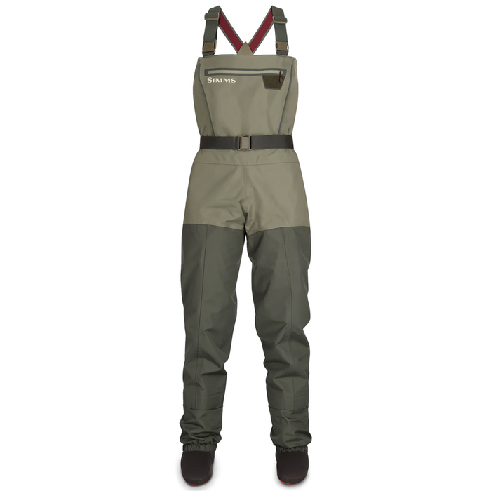 Simms Tributary Stockingfoot Waders - Women's in olive green with adjustable shoulder straps, chest pocket with zipper, integrated belt, and reinforced legs designed for fishing and outdoor water activities.