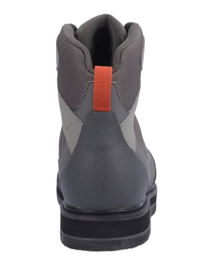 Simms Tributary Wading Boot - Felt Sole shown from the rear, featuring gray and black materials with a padded collar and orange pull tab for easy wear.