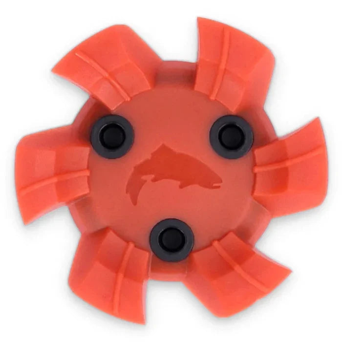 Simms Wading Boot Cleats in bright orange with five curved traction fins and three black mounting screws, featuring a fish silhouette in the center for improved grip on slippery surfaces.
