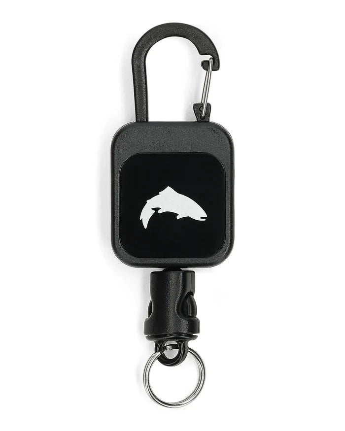 Simms Zinger featuring a black retractable reel with a carabiner clip and a fish silhouette logo, designed for securing fishing tools and accessories.