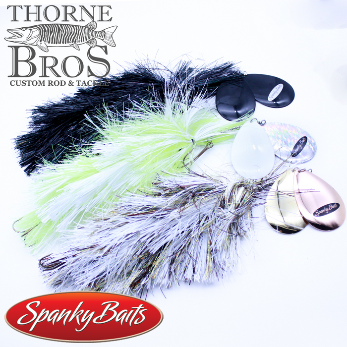 Three Spanky Baits Freak Mag 8 Skirt Bucktail fishing lures in black, chartreuse, and silver with reflective spinner blades, displayed on a white background with Thorne Bros and Spanky Baits logos.