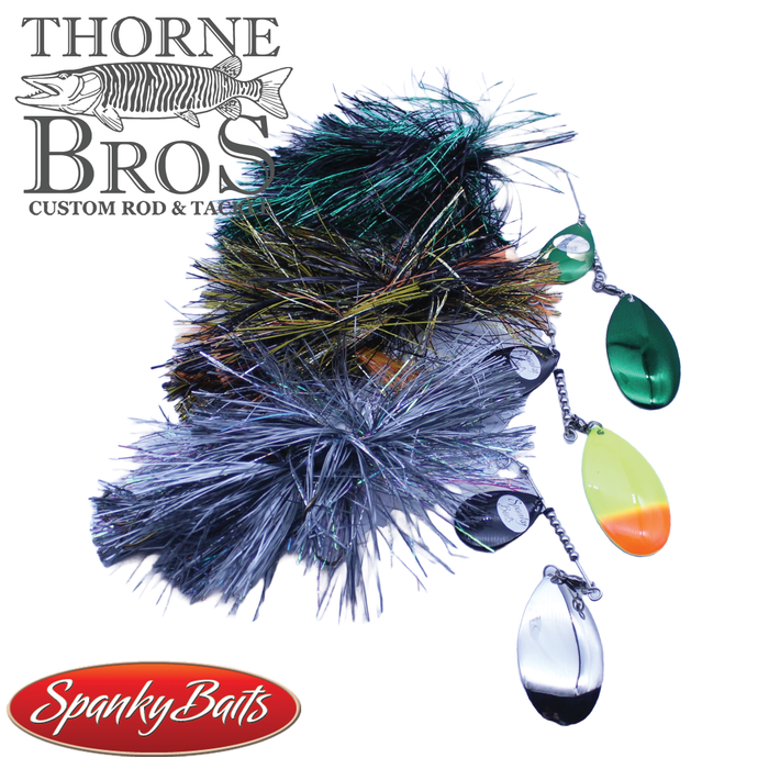 Close-up image of Spanky Baits Whiplash Jr. Spinnerbait fishing lure set featuring three colorful metal spinner blades and flashy synthetic skirt materials, ideal for fishing tackle.