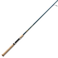 St. Croix Triumph Travel - Spinning fishing rod with a cork handle, sleek black reel seat, and blue rod blank designed for portability and performance in fishing tackle.