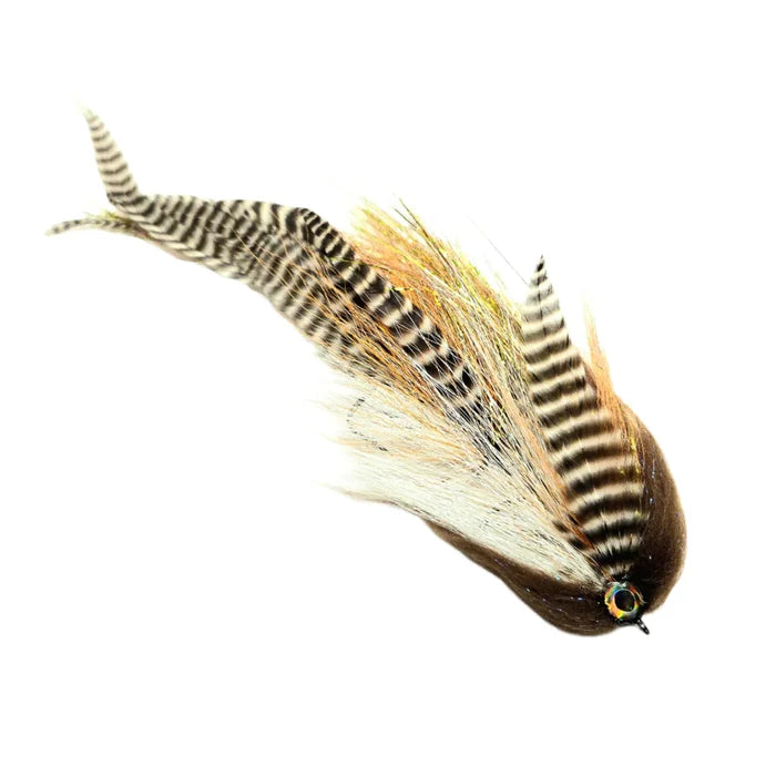 Close-up of a detailed Stream Stalker Flies fishing lure featuring natural brown and tan feathers with striped patterns and an eye detail, designed for musky fishing.