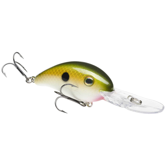 Close-up of a Strike King HC3XD fishing lure with green and yellow body, detailed scale pattern, realistic eye, and two treble hooks, designed for effective fishing tackle use.