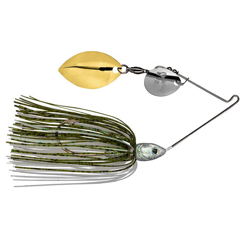 Strike King Tour Grade Spinnerbait with olive and black speckled skirt, silver and gold spinner blades, and a detailed fish head design for fishing tackle enthusiasts.