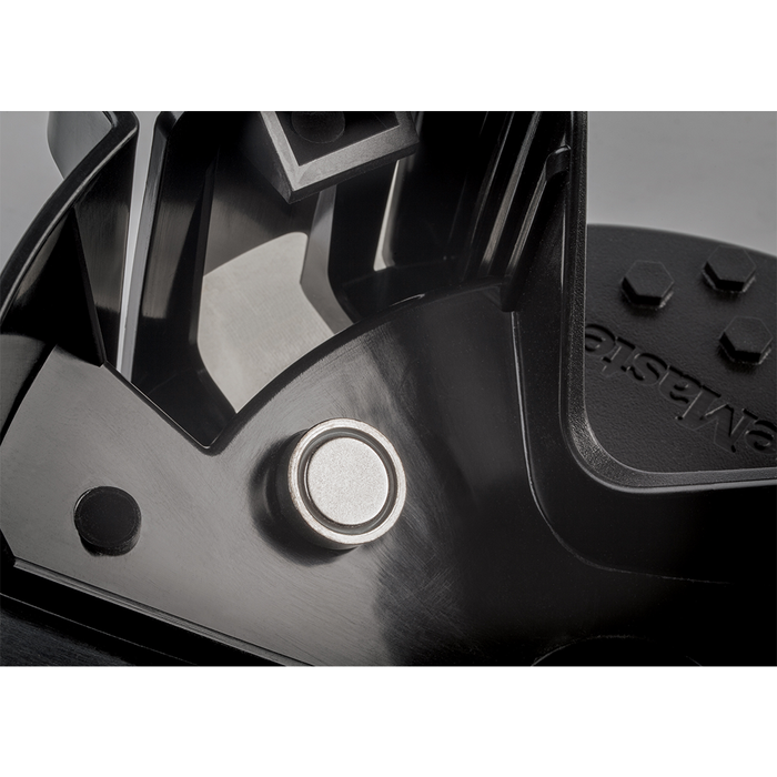 Close-up view of the Strikemaster Magnet Snap Cover (Lite-Flite) showing a circular metal magnet embedded in a black molded plastic fishing tackle component.