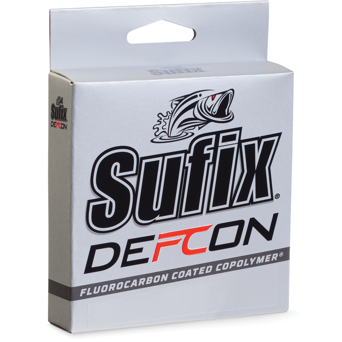 Packaging of Sufix Defcon Fluorocarbon Co-Polymer fishing line, featuring a silver box with bold black and red lettering and a graphic of a fish, designed for fishing tackle use.