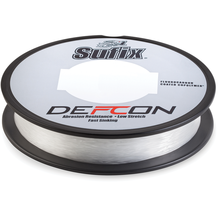 Sufix Defcon Fluorocarbon Co-Polymer fishing line spool in clear color, designed for abrasion resistance, low stretch, and fast sinking, ideal for fishing tackle.