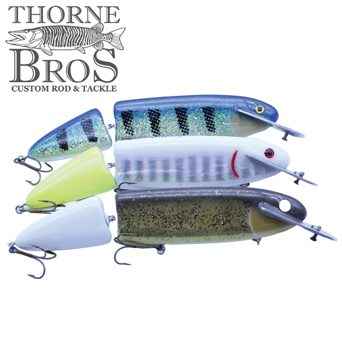 Six detailed Supernatural Jointed Headlock fishing lures in various colors and patterns, featuring jointed bodies and treble hooks, designed for musky fishing.