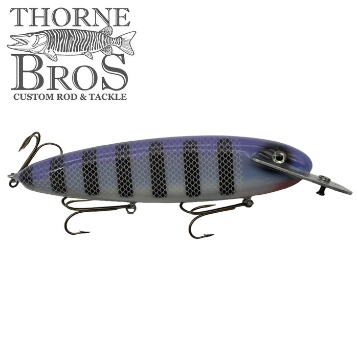 Supernatural Mattlock-10" fishing lure with a purple and black striped body, realistic eye detail, and three treble hooks designed for musky fishing.