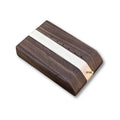 Temperance & Penn Clark's Dubbing Block made of smooth wood with a central lighter stripe, featuring multiple small holes and a wooden peg for organizing fishing tackle materials.