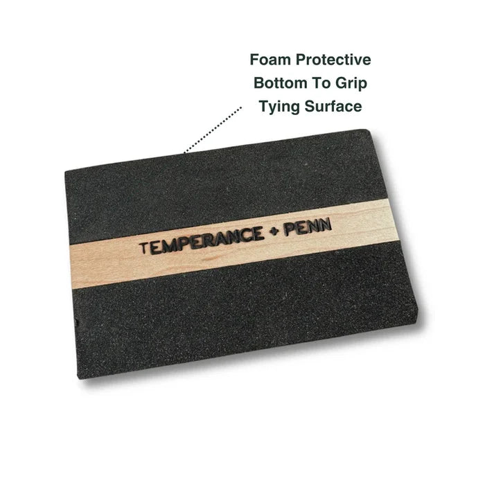 Temperance & Penn Clark's Dubbing Block with foam protective bottom and wooden center strip for secure grip and efficient fly tying on a durable black surface.
