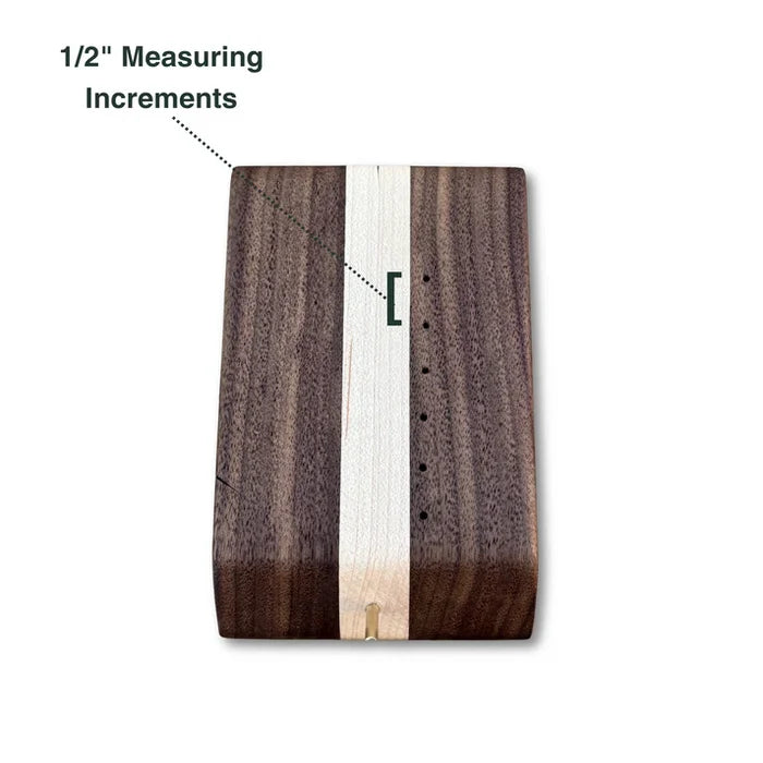 Temperance & Penn Clark's Dubbing Block made of dark and light wood with 1/2 inch measuring increments for precise fly tying and fishing tackle customization.