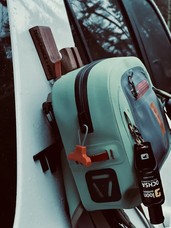 Temperance & Penn Gear Hook-Magnetic holding a fishing tackle box securely attached to the side of a boat, showcasing durable magnetic fishing gear organization.