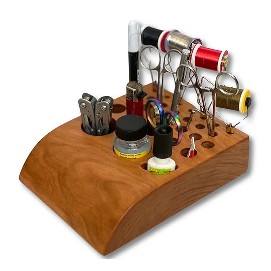 Temperance & Penn Tool Holder made of polished wood, holding various fishing tackle tools including thread spools, scissors, clippers, and bottles for fly fishing gear organization.