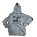 Thorne Bros Fly Fishing Logo Hoodie in heather gray with front kangaroo pocket and black printed logo featuring fishing fly and text, made for anglers.