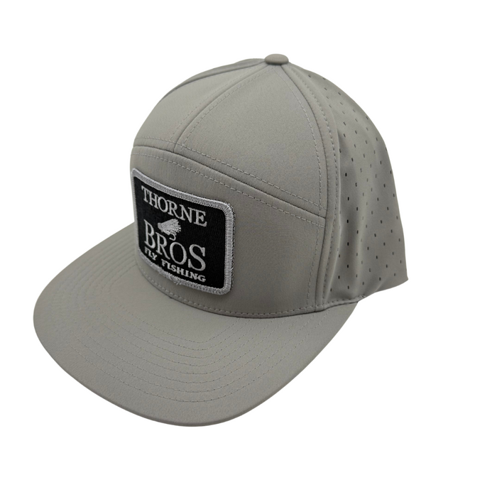 Thorne Bros Fly Fishing Logo Richardson 169 Cannon Cap Grey featuring a structured grey design with perforated breathable panels and a black embroidered patch logo, ideal for fishing enthusiasts.