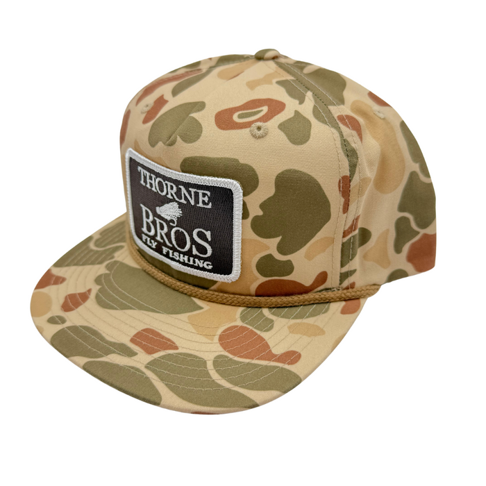 Thorne Bros Fly Fishing Logo Richardson Umpqua 256P Light Camo hat featuring a classic light camouflage pattern and embroidered patch logo, designed for outdoor fishing enthusiasts.