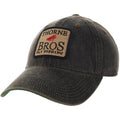 Thorne Bros. Fly Fishing Old Favorite Legacy Hats featuring a dark, weathered fabric with stitched front patch displaying the brand logo and fly fishing graphic.