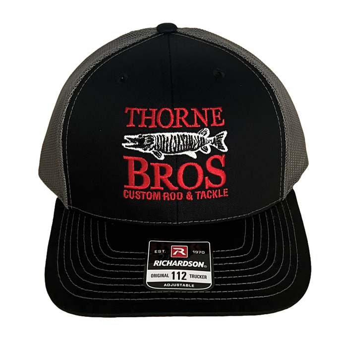 Thorne Bros. Logo Richardson 112 Embroidered cap in black and gray mesh with red and white fishing-themed logo featuring a musky fish and custom rod and tackle text.