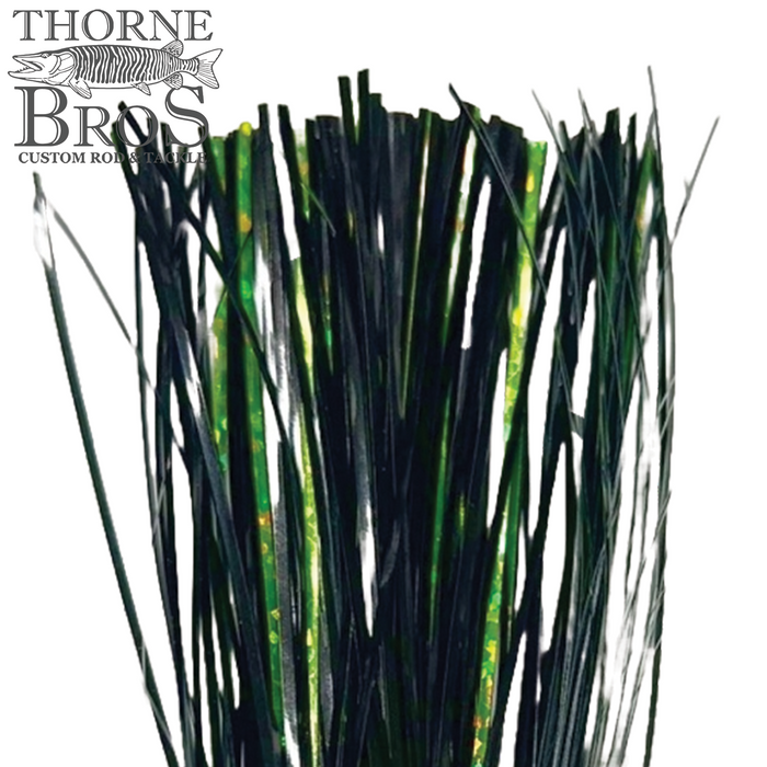 Close-up image of Thorne Brothers Pre-Tied Tinsel Skirt-Blended Tinsel featuring iridescent green and black strands designed for fishing tackle and lure customization.