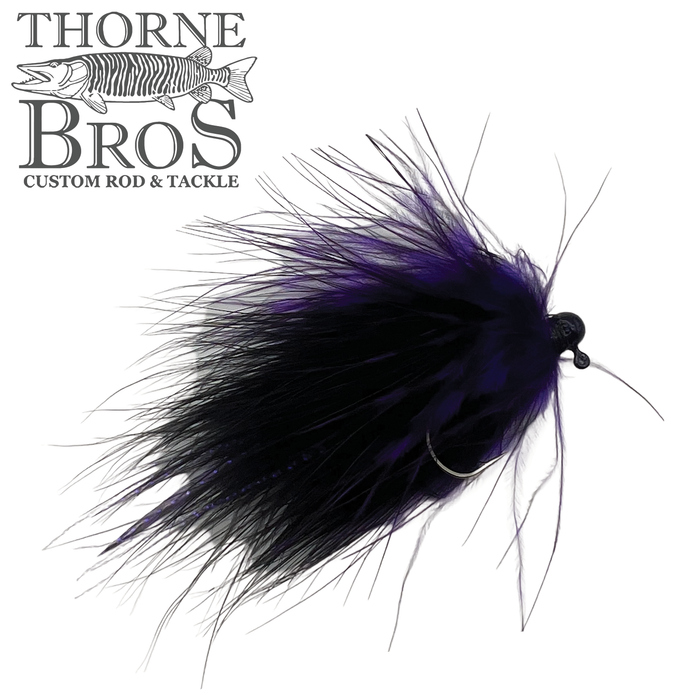 Thorne Brothers Tungsten Marabou Jig featuring a detailed black and purple marabou feather design with a tungsten weighted hook, ideal for fishing tackle and lures.