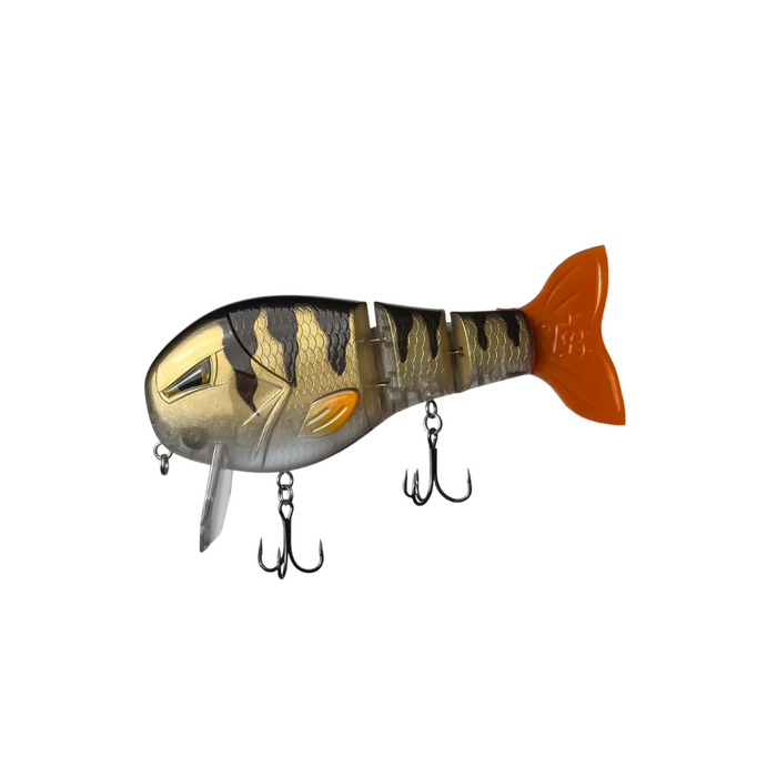 Throwback Swimbaits Wake Walker LT fishing lure with segmented body, realistic fish pattern in gold and black stripes, and bright orange tail featuring two treble hooks.