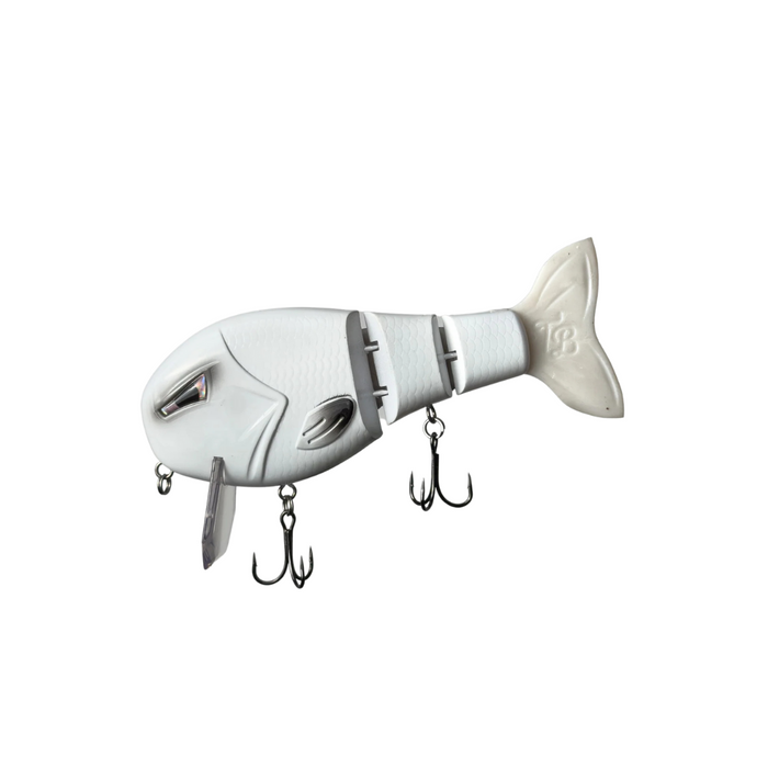 White segmented fishing lure with detailed fish scale texture, two treble hooks, and a fin with "TB" embossed, designed for musky fishing, labeled Throwback Swimbaits Wake Walker LT.