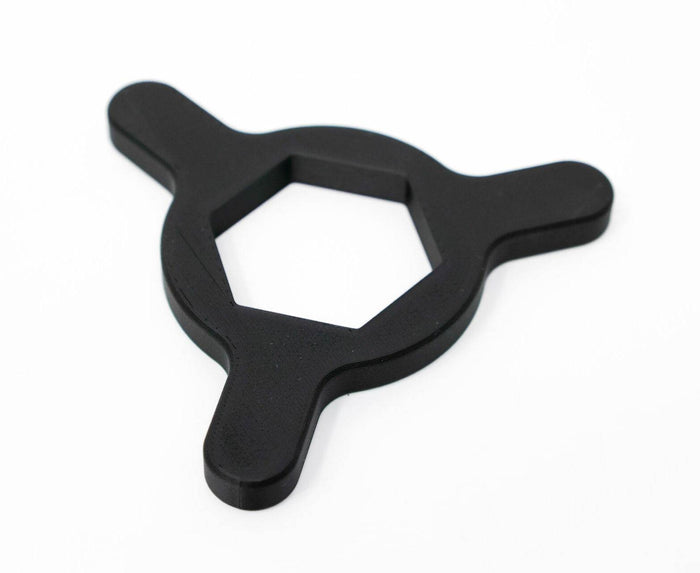 TKI Base Nut Wrench 611-0624-02, black three-pronged tool with a hexagonal center designed for tightening or loosening fishing tackle components.