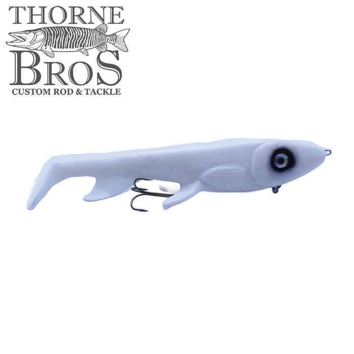 Trophy Systems Bait Co. 12" Stealth Bomber fishing lure in white with black eye detailing and a treble hook, designed for musky and other large fish.