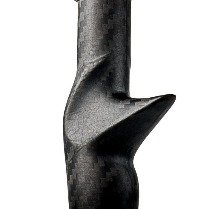 Close-up view of Tsuka 2 Carbon Handle for Casting Rods showing textured black carbon fiber material with ergonomic grip design for improved handling in fishing tackle.