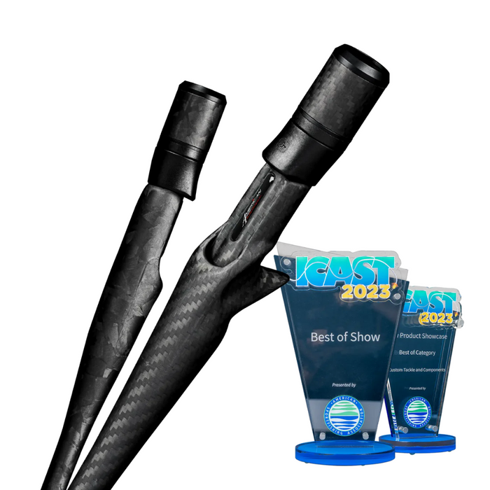 Two black Tsuka 2 Carbon Handle for Casting Rods displayed alongside two blue ICAST 2023 award trophies for Best of Show and Best of Category.