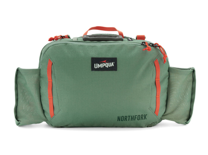 Umpqua Northfork Waist Pack in green with multiple zippered compartments, side mesh pockets, and red zipper pulls, designed for organized fishing tackle storage.
