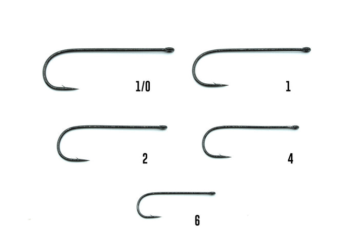 Close-up of five different sizes of fishing hooks arranged on a white background, labeled 1/0, 1, 2, 4, and 6, associated with the Umpqua X-Series XT350 fishing tackle set.